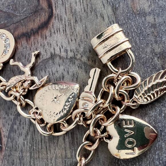 Gold tone charm adjustable charm bracelet- feather, lock, heart, star, moon - Picture 3 of 9